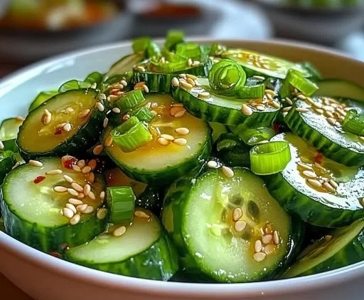 Simple Asian cucumber salad with fresh vegetables and a tangy dressing.