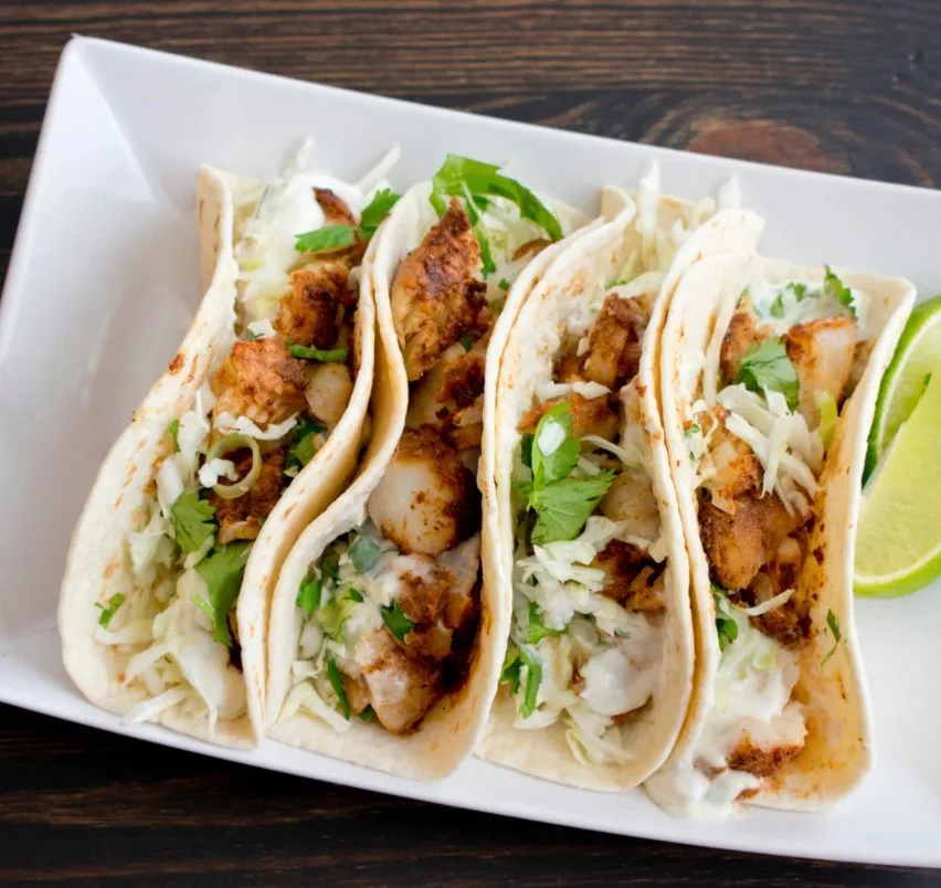 Spicy Lime Fish Tacos served with fresh ingredients and zesty lime