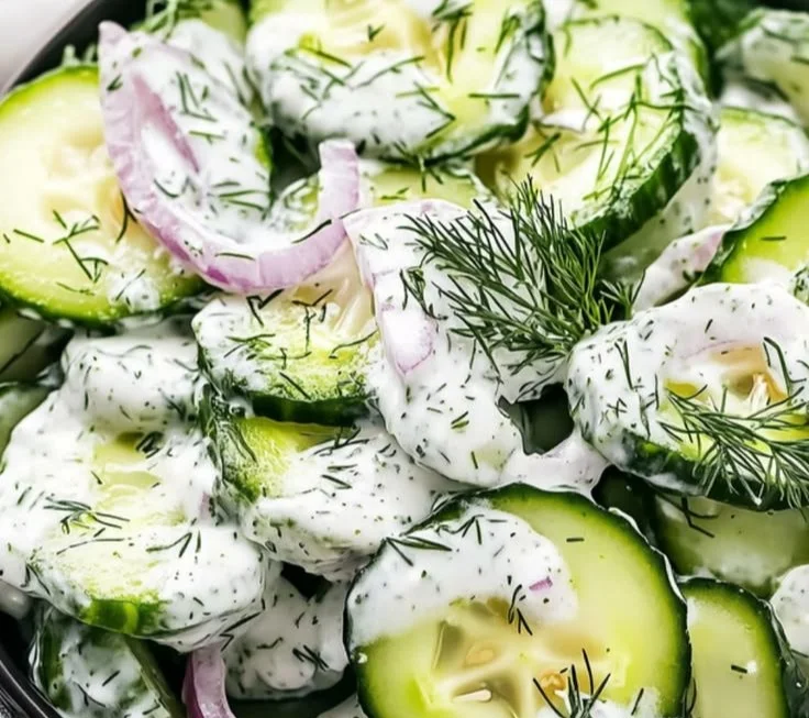 Cucumber Dill Salad with fresh herbs and diced cucumbers in a bowl.