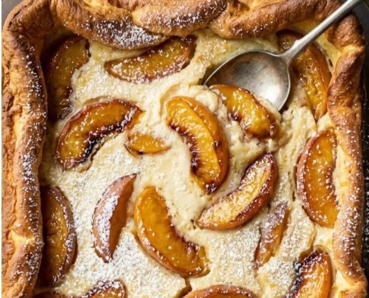 Baked Peach Cobbler Cottage Cheese Breakfast Bowl topped with fresh peaches and spices