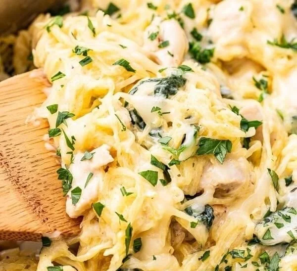Chicken and Spinach Spaghetti Squash Alfredo dish served in a bowl.