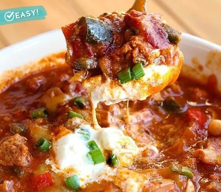 Easy ground beef and chorizo chili served in a bowl with toppings.