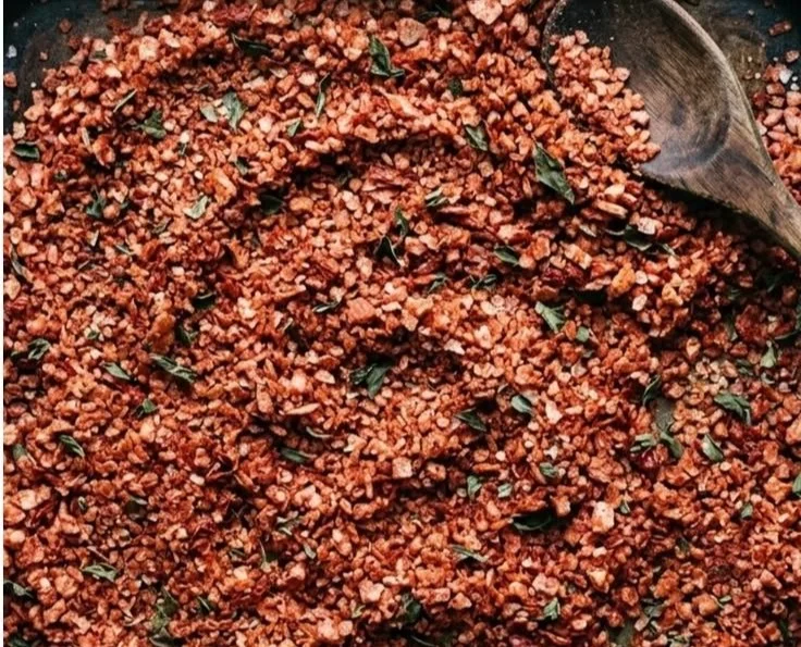 Bowl of homemade seasoning salt on a wooden table