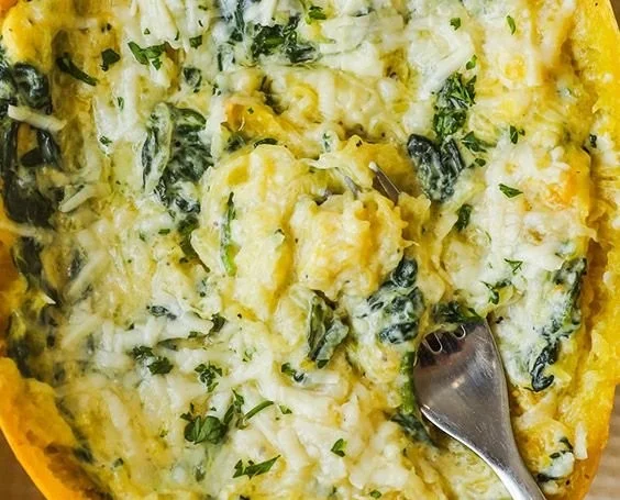 Delicious garlic parmesan spaghetti squash with fresh spinach and creamy sauce
