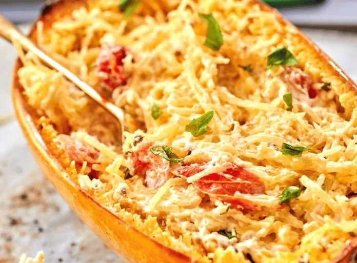 Baked feta spaghetti squash topped with fresh herbs and spices, gluten-free dinner
