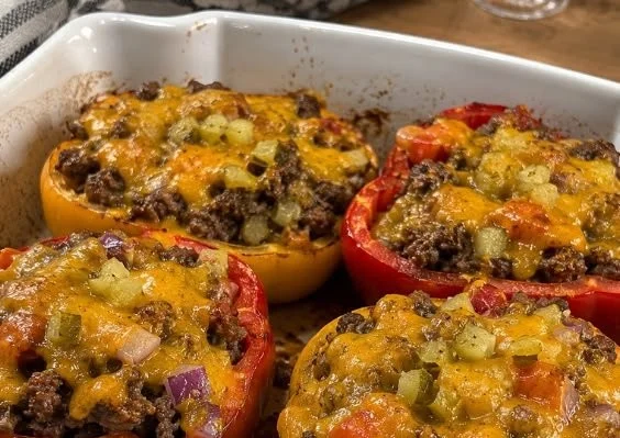 Cheeseburger stuffed peppers filled with ground beef and topped with cheese