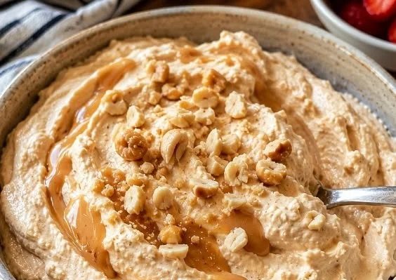 Keto whipped peanut butter cottage cheese dish topped with nuts